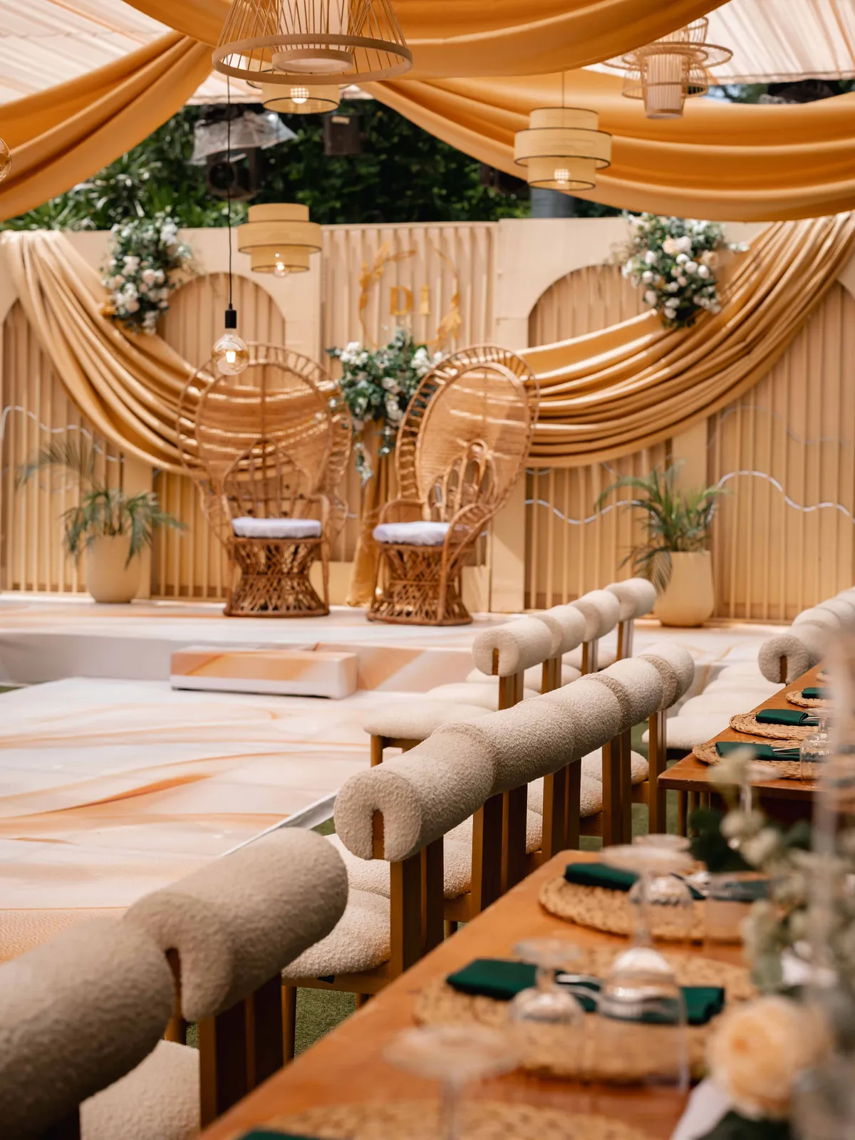Long banquet table styled with greenery and gold accents