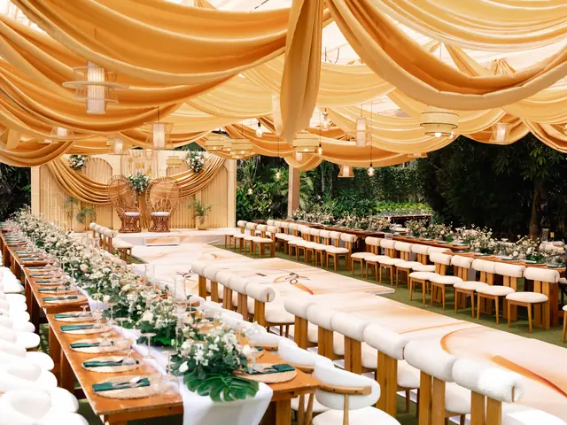 Reception hall with long tables fully set